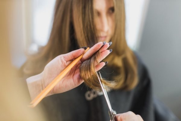 woman-getting-hair-cut-at-salon